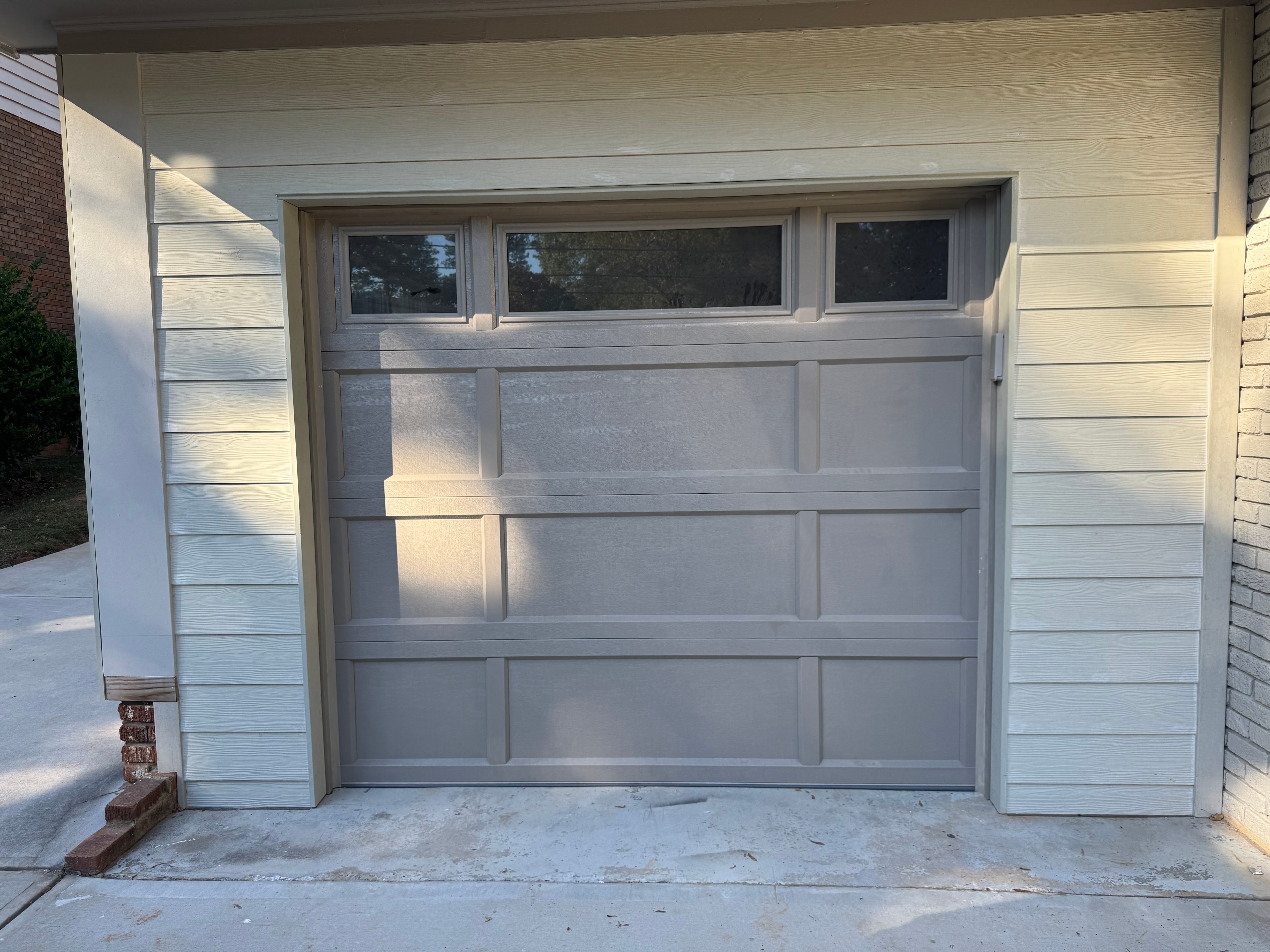 White garage door with windows