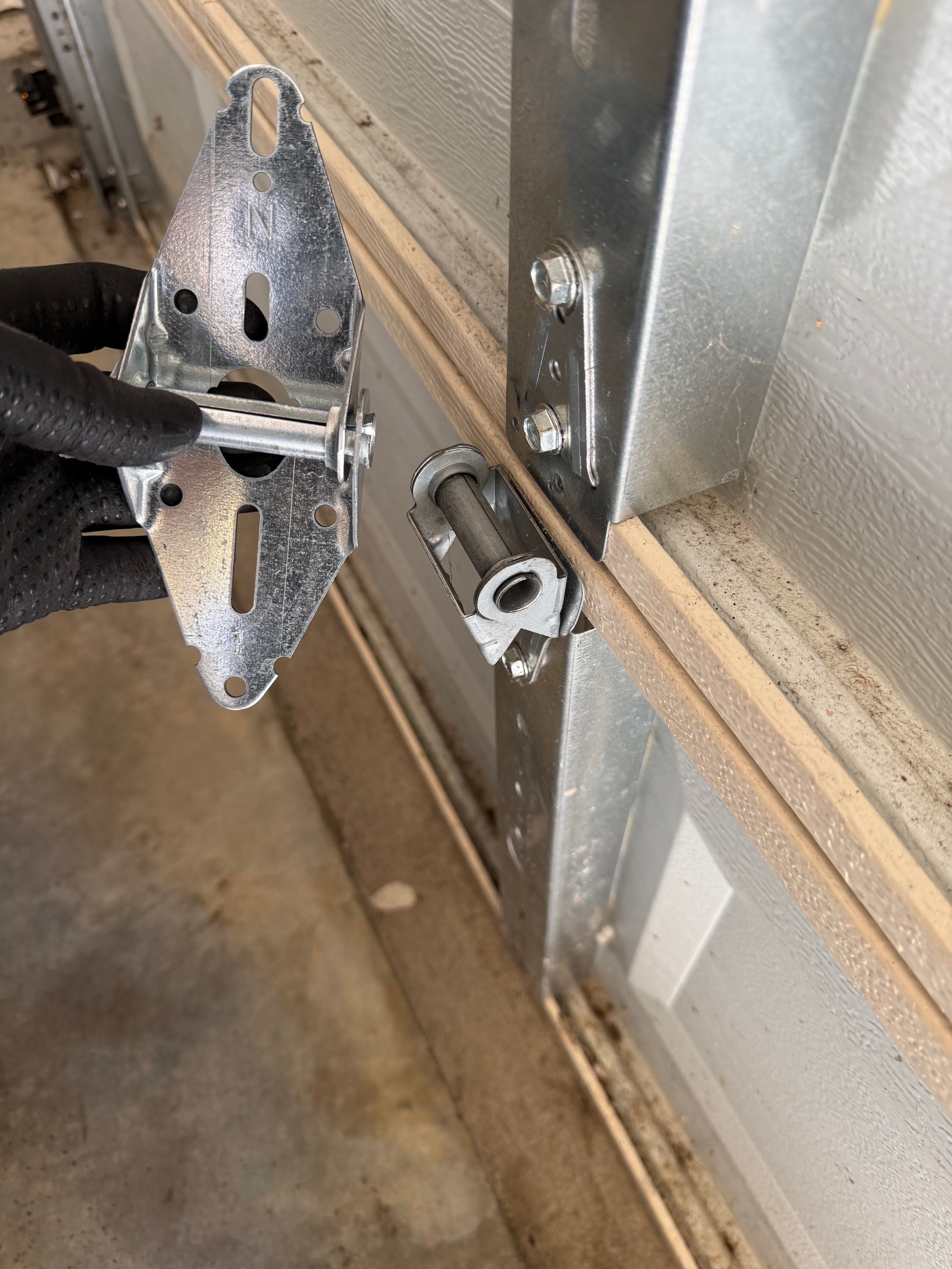 Garage door hinge and hardware repair